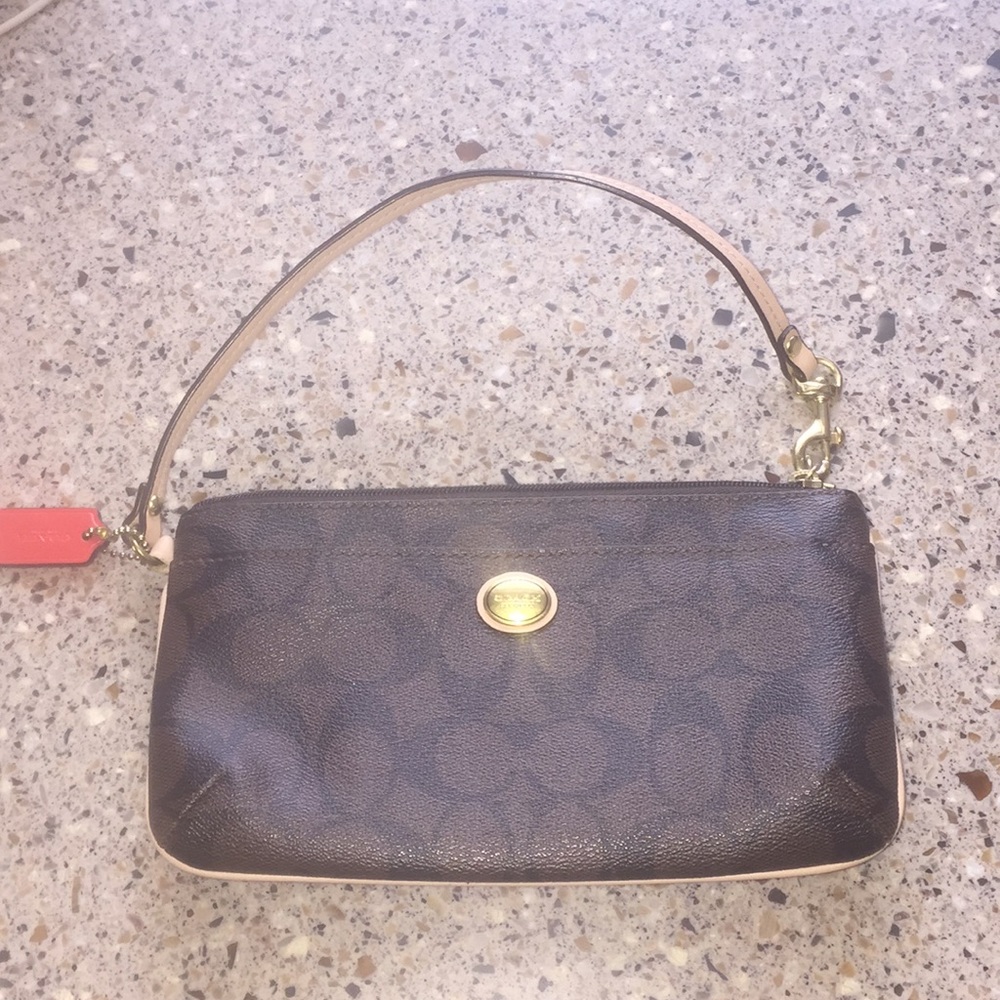 Like new. Coach wristlet